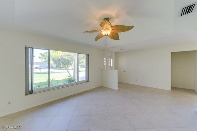 unfurnished room with ceiling fan and light tile patterned floors