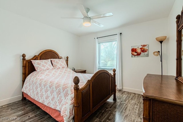 bedroom featuring dark wood-type flooring and ceiling fan