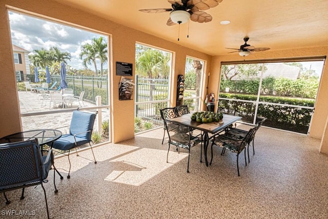 sunroom / solarium with ceiling fan