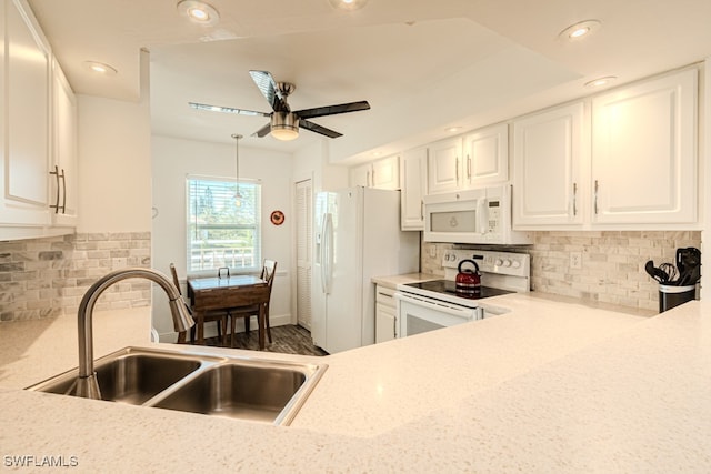 kitchen with white cabinetry, decorative backsplash, white appliances, light stone counters, and sink