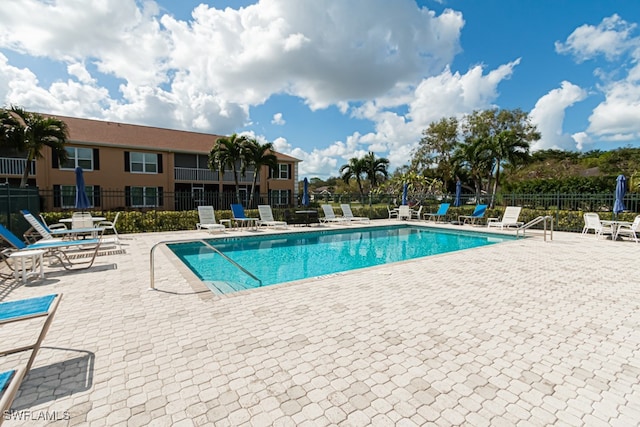 view of swimming pool featuring a patio area