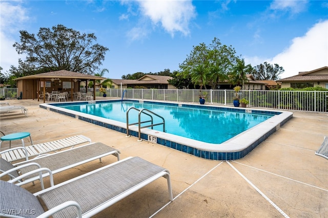 view of pool featuring a patio area