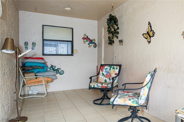 sitting room with tile patterned flooring