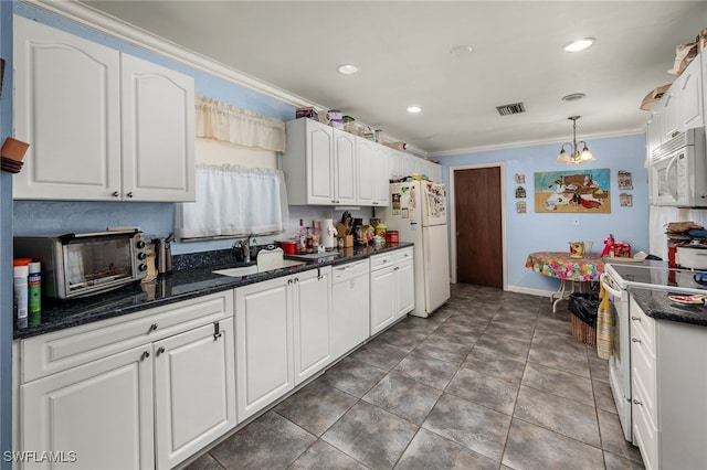 kitchen featuring ornamental molding, white cabinetry, decorative light fixtures, and white appliances