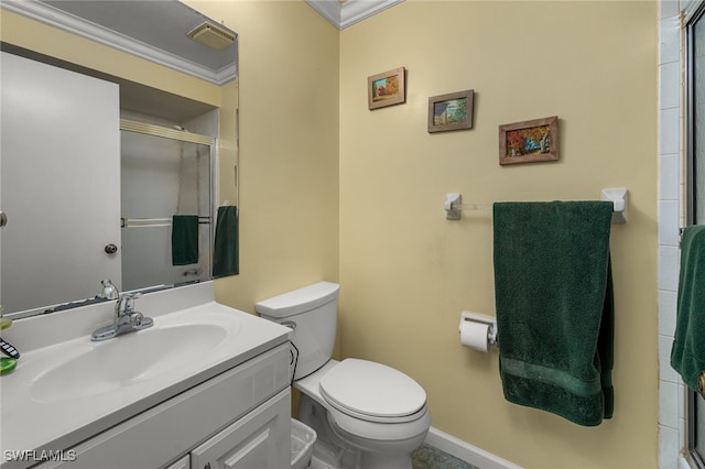 bathroom featuring vanity, crown molding, toilet, and walk in shower