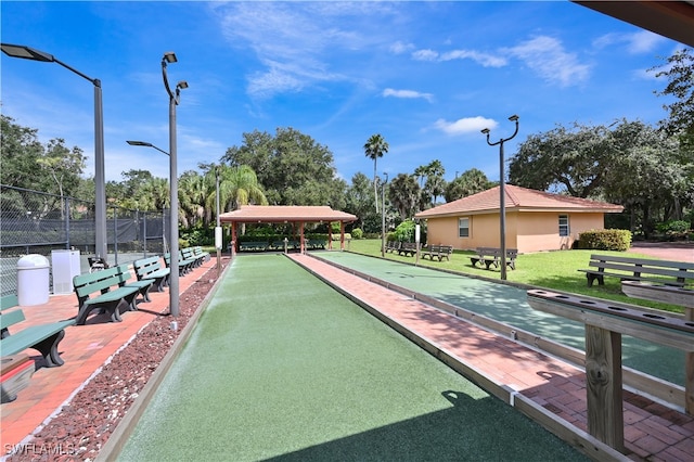 view of property's community featuring a yard