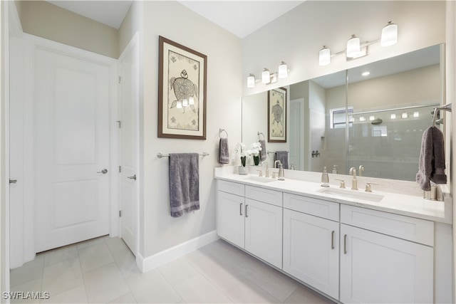 bathroom featuring vanity, a shower with shower door, and tile patterned flooring