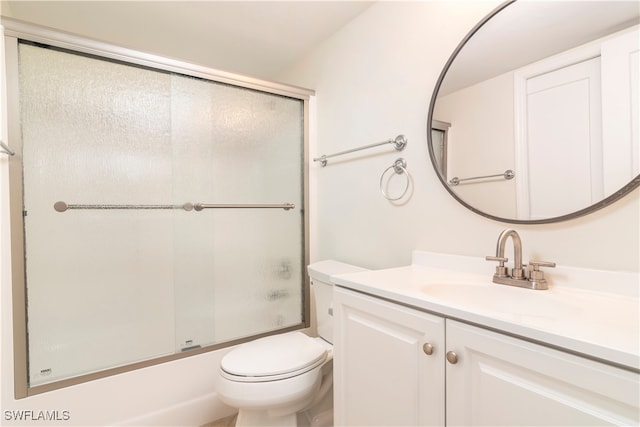 full bathroom with toilet, enclosed tub / shower combo, and vanity