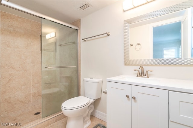 bathroom featuring vanity, toilet, tile patterned floors, and an enclosed shower