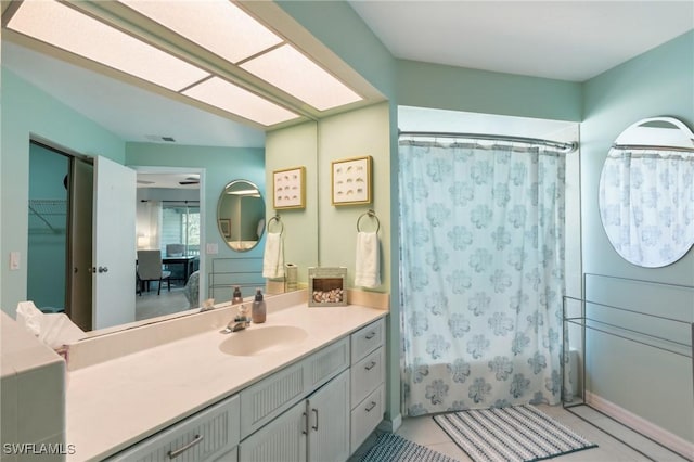 bathroom featuring visible vents, vanity, and tile patterned flooring