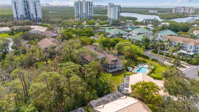 birds eye view of property with a view of city and a water view