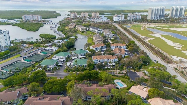 drone / aerial view featuring a view of city and a water view