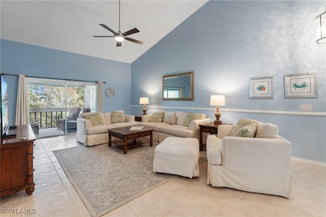 tiled living area featuring baseboards, high vaulted ceiling, and ceiling fan