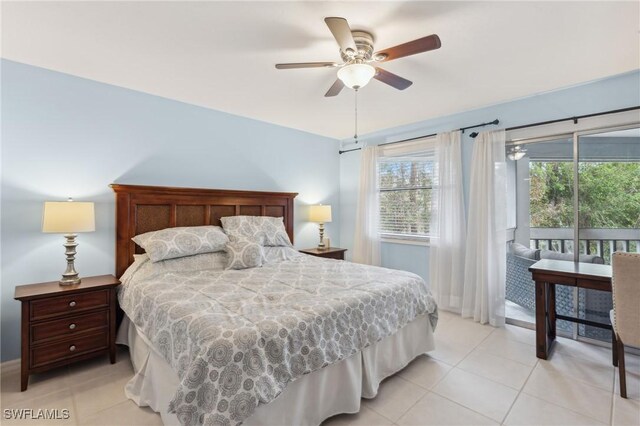 bedroom featuring access to exterior, light tile patterned floors, and a ceiling fan