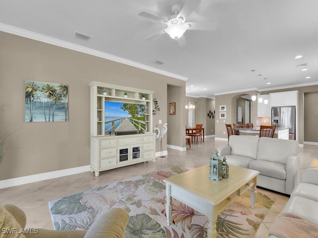 living room featuring crown molding, light tile patterned floors, and ceiling fan with notable chandelier