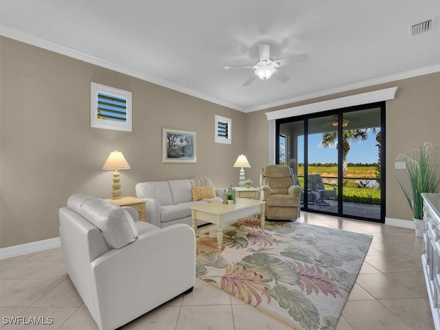 living room featuring ceiling fan, ornamental molding, and light tile patterned floors