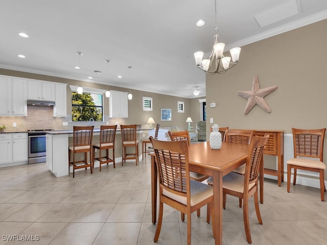 dining area with crown molding, an inviting chandelier, and light tile patterned floors