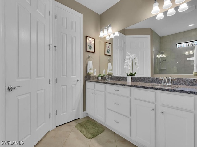 bathroom featuring vanity, walk in shower, and tile patterned flooring