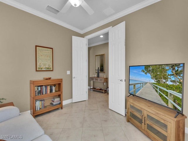 living room featuring ornamental molding, light tile patterned flooring, and ceiling fan