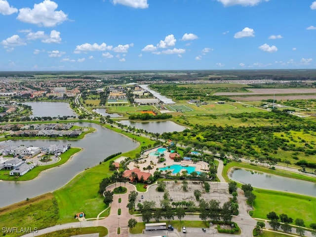 birds eye view of property with a water view