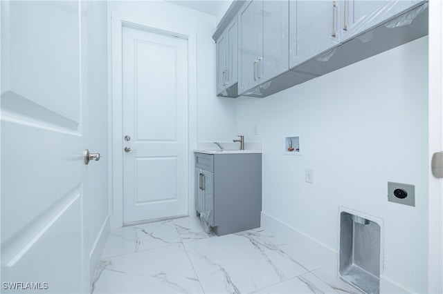 laundry room with cabinets, hookup for an electric dryer, sink, and hookup for a washing machine