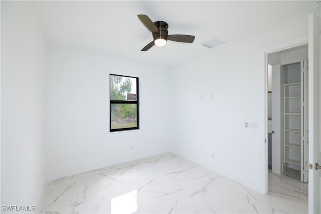 empty room featuring ceiling fan