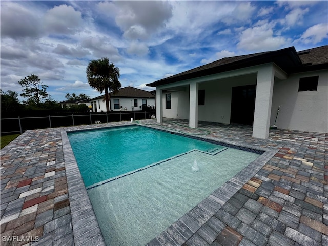 view of swimming pool featuring a patio area