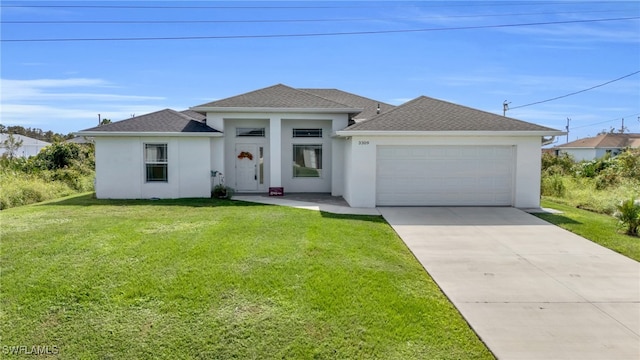 view of front of property featuring a garage and a front yard