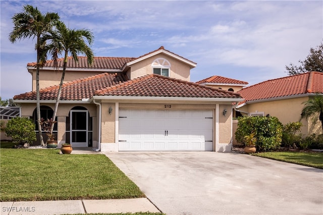 mediterranean / spanish-style house with a front yard and a garage