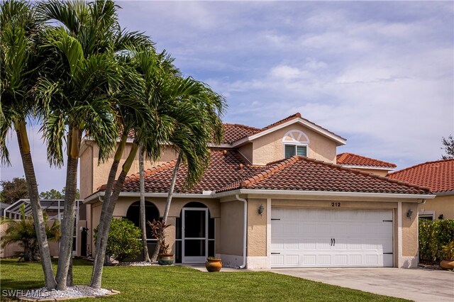 mediterranean / spanish-style house with a front yard and a garage