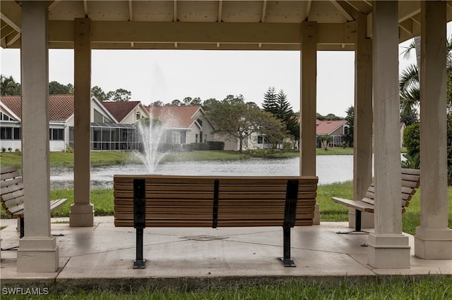 exterior space with a water view and a gazebo