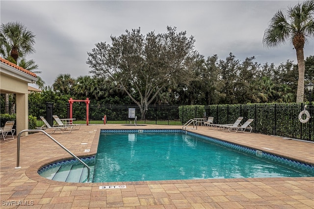 view of pool featuring a patio