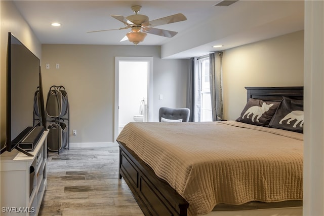 bedroom with light hardwood / wood-style floors and ceiling fan