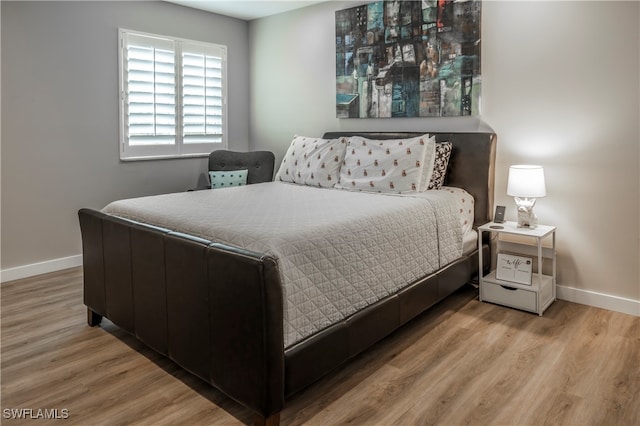 bedroom featuring wood-type flooring