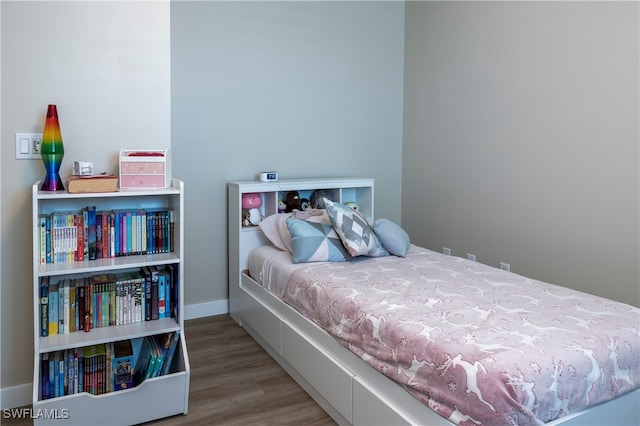 bedroom featuring hardwood / wood-style flooring