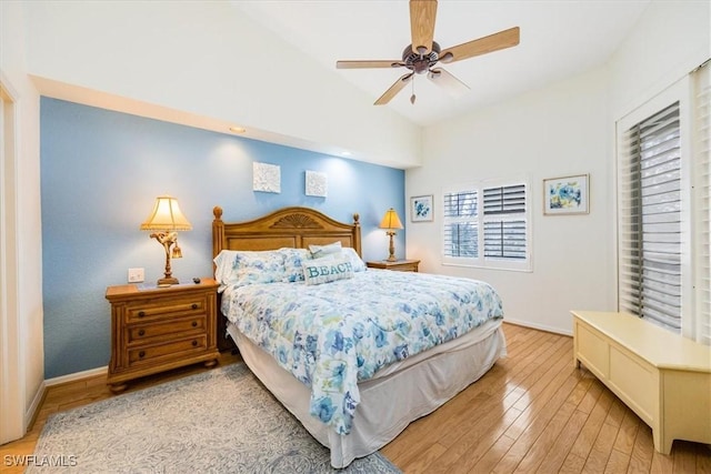 7725 Pebble Creek Cir Unit 8-303, Naples, FL 34108 - bedroom with vaulted ceiling, light wood finished floors, ceiling fan, and baseboards