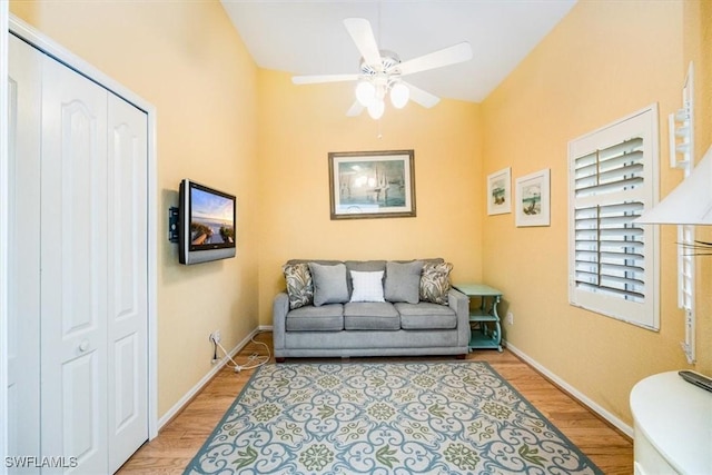 7725 Pebble Creek Cir Unit 8-303, Naples, FL 34108 - living area featuring light wood-style floors, ceiling fan, baseboards, and lofted ceiling