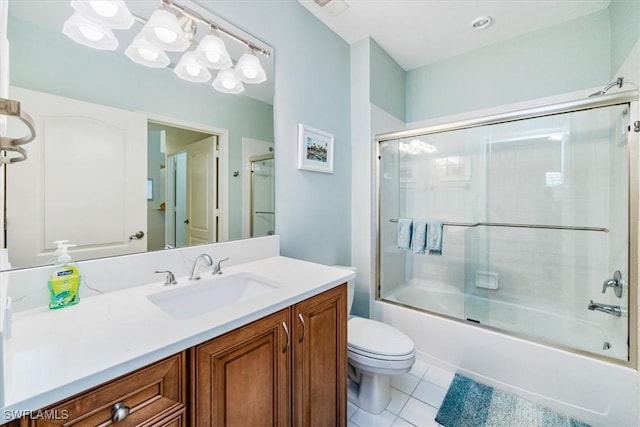 7725 Pebble Creek Cir Unit 8-303, Naples, FL 34108 - bathroom featuring toilet, tile patterned floors, vanity, and shower / bath combination with glass door
