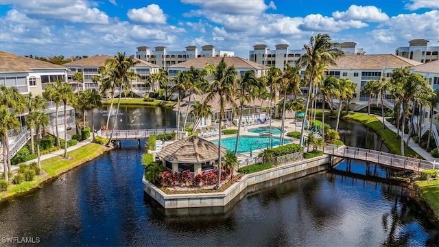 7725 Pebble Creek Cir Unit 8-303, Naples, FL 34108 - drone / aerial view of a large body of water and a pool