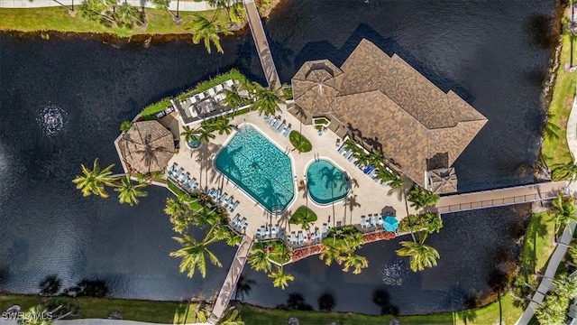 7725 Pebble Creek Cir Unit 8-303, Naples, FL 34108 - aerial view of a pool area and a large body of water