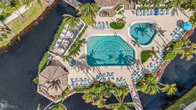 7725 Pebble Creek Cir Unit 8-303, Naples, FL 34108 - bird's eye view of a pool and a large body of water