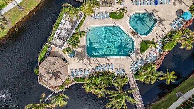 7725 Pebble Creek Cir Unit 8-303, Naples, FL 34108 - drone / aerial view of a pool area and a large body of water