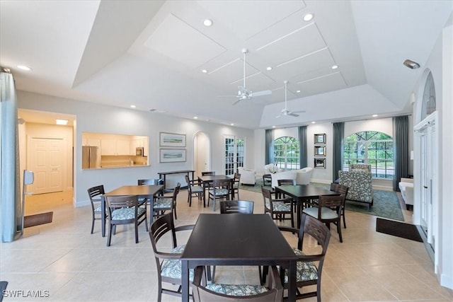 7725 Pebble Creek Cir Unit 8-303, Naples, FL 34108 - dining space with a ceiling fan, light tile patterned flooring, recessed lighting, a raised ceiling, and arched walkways