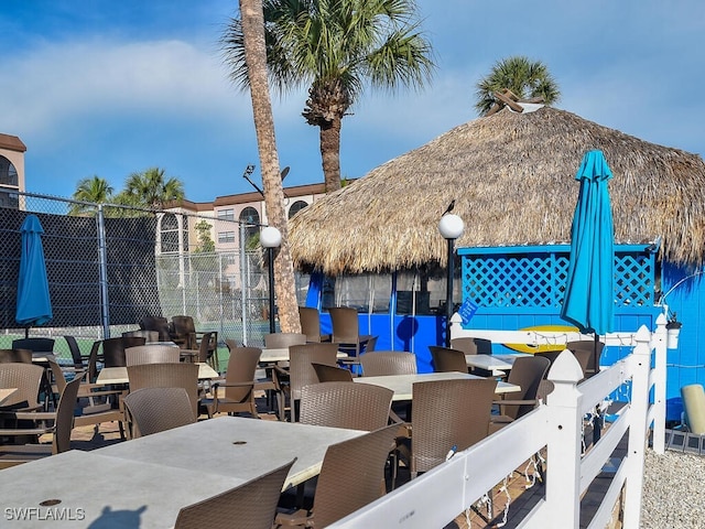 view of patio / terrace featuring fence and outdoor dining space