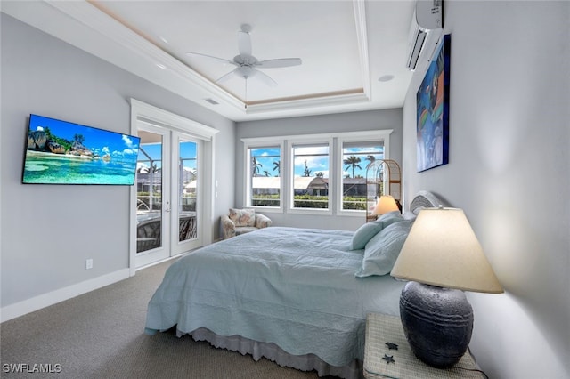 bedroom featuring a raised ceiling, ceiling fan, access to outside, carpet floors, and an AC wall unit