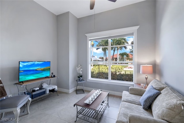 living room with light tile patterned floors and ceiling fan