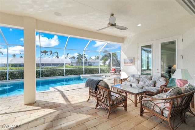 view of patio / terrace with ceiling fan, a lanai, and outdoor lounge area