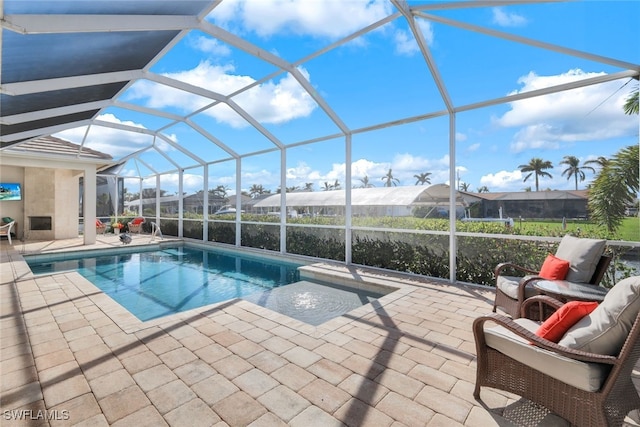 view of pool featuring a patio area and a lanai