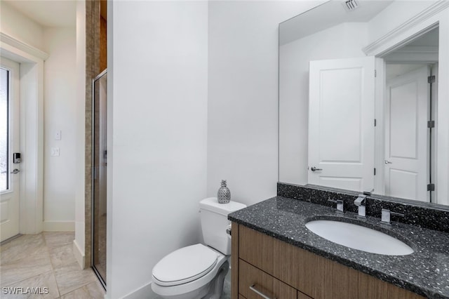 bathroom featuring vanity, walk in shower, toilet, and a wealth of natural light