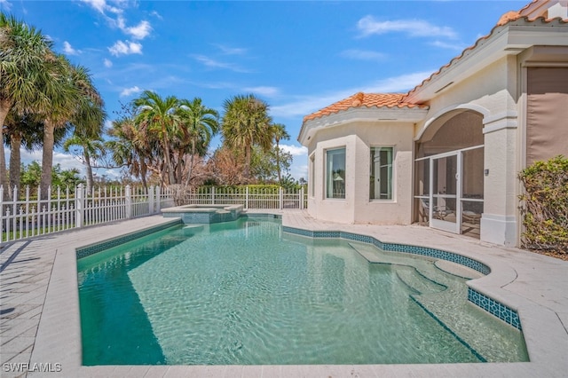 view of pool featuring a sunroom and an in ground hot tub